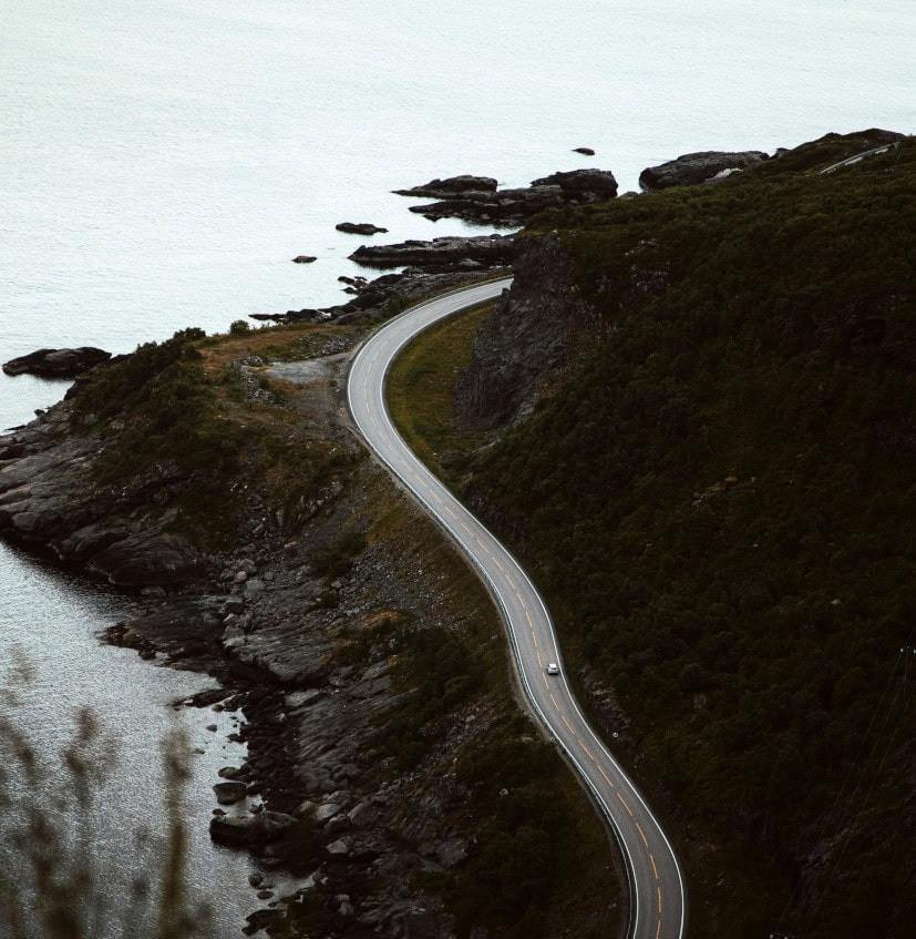 The Long Road To being Diagnosed With Fibromyalgia a road passes alongside the coast